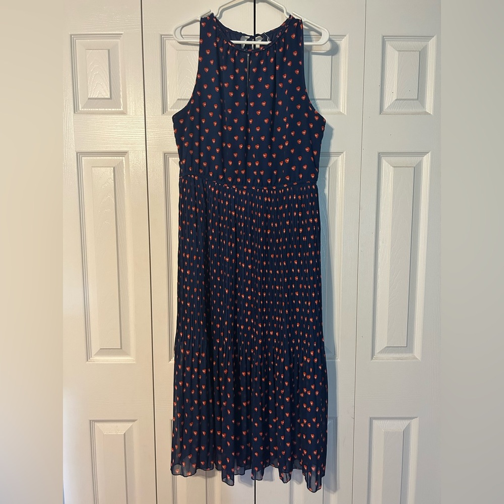 Cute navy dress w/ red/white hearts. Top has keyhole opening on front & back.